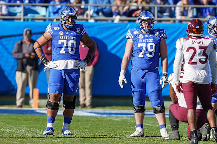 Darian Kinnard (left) is a massive offensive line prospect with excellent power.